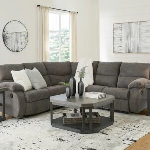 A two-piece sectional with light gray microsuede upholstery.