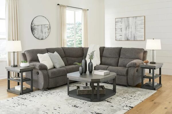 A two-piece sectional with light gray microsuede upholstery.